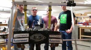 Team 458 shows off their robot hang in the lab.