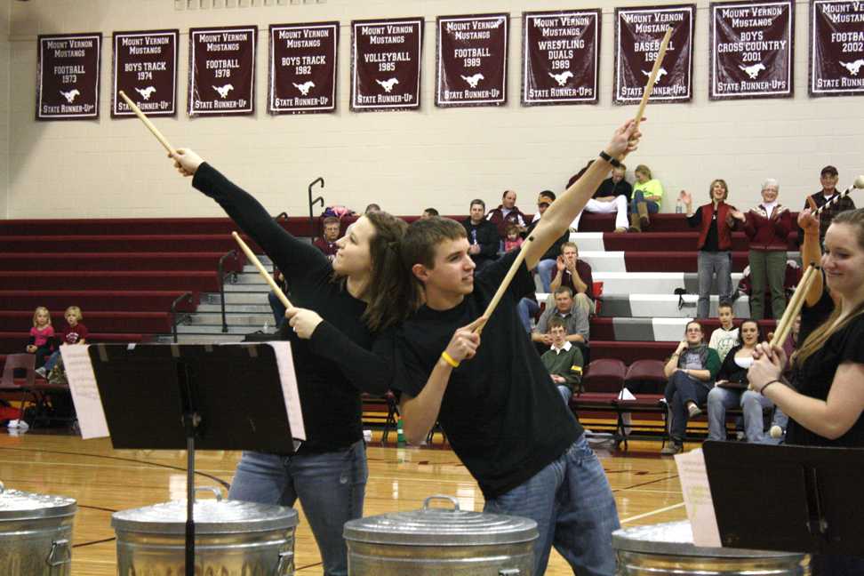 Janelle Knight and Cory Brannaman strike pose after performing at the basketball game Dec 10.