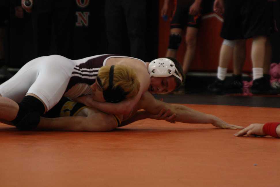 Five Wrestlers Advance to Districts