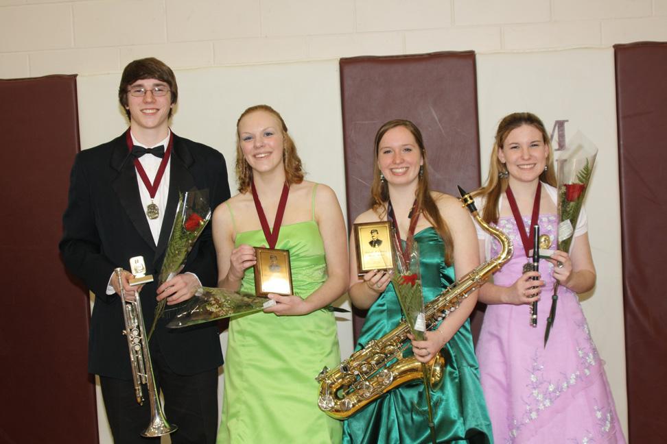 Stephen Gruber-Miller, Khloe Rand, Abigail Chihak, and Polly Carrico pose with their awards Tuesday, May 3.