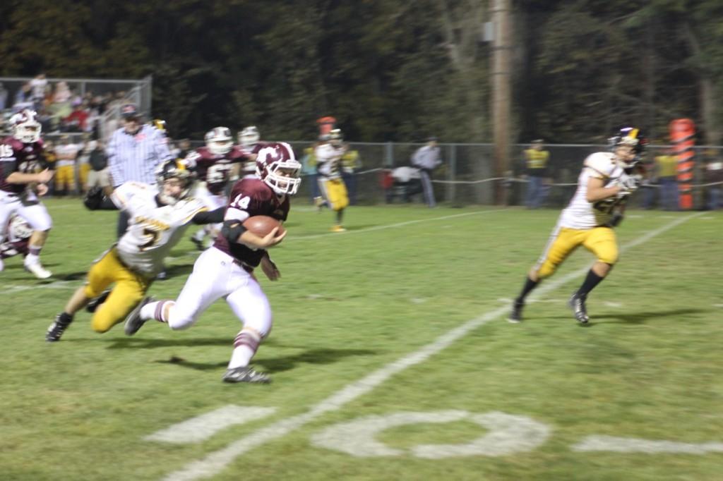 Falcons just cant tackle a Mustang.  Here Marshall Tuerler runs in a touchdown, one of his four for the night.