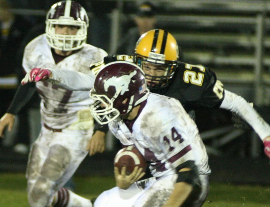 Marshall Tuerler carries the ball as a determined CPU player goes in for the tackle.  Phot by Ashley Ruden