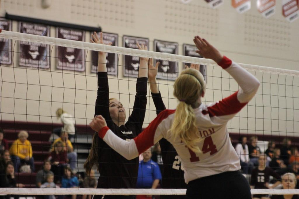 Sophomore Kate Lynott goes up for the block against Marion Oct. 11  Mount Vernon beat Marion in quarterfinals at the WaMaC Conference Tourney 18-25, 25-15, and 15-5.  The Mustangs fell to Solon in two at Semifinals, 26-24, 25-22. Photo by Hannah Bradbury,