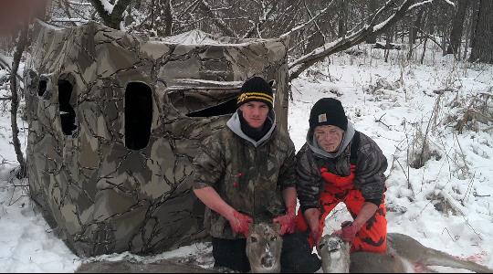 Hunter Hutchinson and Kyle Durgin pose with the does they harvested on Christmas Eve of 2012.