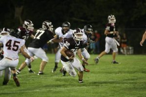 Trey Ryan runs the ball for Mount Vernon in the second quarter against Solon Aug. 30.  Trey made 13 tackles for the Mustangs, 11 of them solo.Photo by Gabby Kolker.