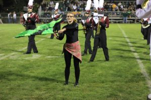 Renny Klein performs with the color guard at halftime Sept 13. Photo by Lexi Kelly.