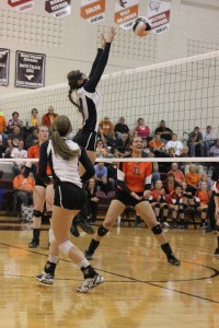 Hannah Whitley goes up for a block against Solon Oct. 8. Photo by Laura Deininger.