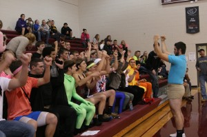 Mitch Wirfs leads the costumed crowd in a roller coaster cheer on Halloween.