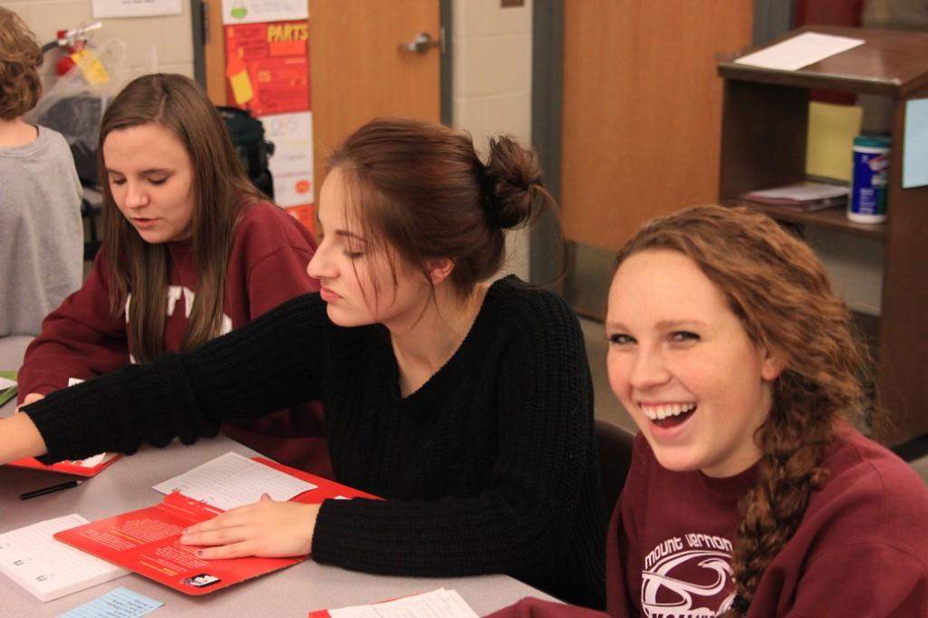 Science Olympiad members junior Haley Smith, and sophomores Jennifer Deininger and Emma Bradbury enjoy a game of Scattergories using science terms at a teambuilding night in November. Photo by Wyatt Swartzendruber.