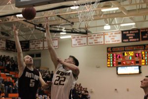 Tommy Hook goes up for a shot against Regina third quarter in the 2A District Final game against Regina.  Tommy scored 31 points, 20 in the first half. Photo by Claire Pettinger.