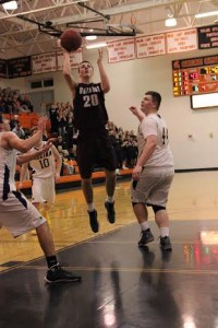Connor Herrmann shoots a basket at district finals Tuesday. 