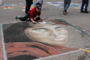 Eighth grader Maggie Lynott won the 2014 Chalk the Walk competition with her recreation of an iconic photo. She will be invited back as the featured artist in 2015.