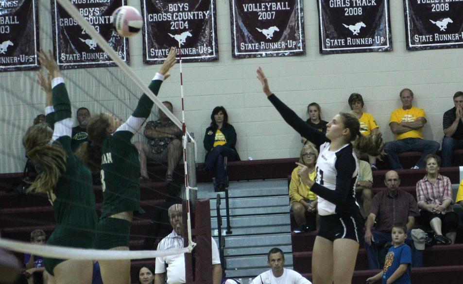 Sophomore Kaitlyn Volesky gets one past the Blazers Sept. 9. The Mustangs won in three sets. Photo by Claire Pettinger.