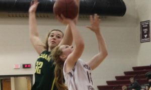 Jacque Murray takes a shot in the 63-57 win Feb. 6 over Dyersville Beckman. The Mustangs went on to finish the regular season with a win against DeWitt Central in overtime, 59-58. In first round regionals, the Mustangs beat Tipton 72-38 and went on for a win against Camanche Wed 55-50.