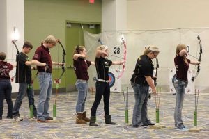 Mount Vernon's Isaiah Exley-Schuman and Emily Friedman shoot at state March 7. Emily tied for 4th place for the team with a score of 279. Photo by Lexi Kelly