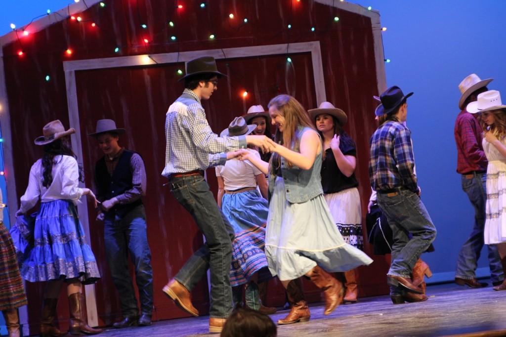 Cowboy Bob (junior Chris Cripe) dances with Rusty (junior Hannah Clark).