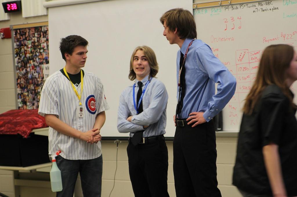 Luke Moran, Sam Krapfl, and Simon Crocker take on the roles of Social Studies teacher Ed Timm, Activities Director Matt Thede, and Principal Steve Brand in The Dramatic Interpretation of Literature  play Ides of May. Performances were April 7-8. Photo by Kelsey Shady.