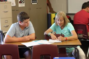 In her Spanish 2 class, Mrs. Deibner helps freshman Reece Pitlik. On Aug 27 her class learned new Spanish vocab. 