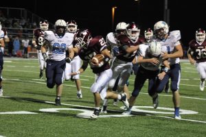 Senior Charlie Engelbrecht runs the ball fourth quarter against Goose Lake. The Mustangs won, 53-15. Photo by Sam White.