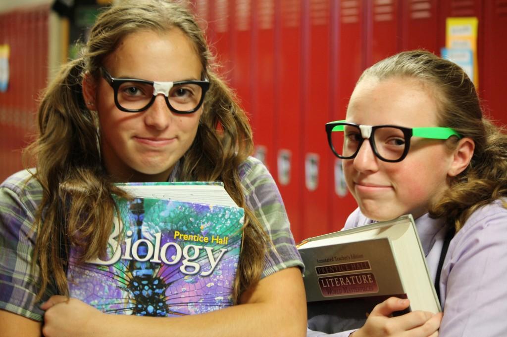 Freshmen Sydney Hauser and Sam White dress as some cute geeks on jocks vs. geeks day for homecoming. Student council is attempting to get more participation this year by offering prizes.