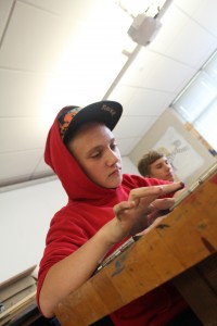 Freshman Aiden Frantz creates a picture in a beginning drawing class on Aug 27