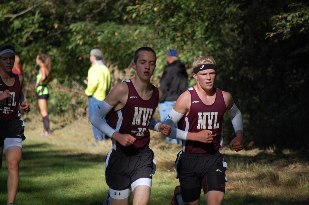 Jack Young and Chase McLaughlin run at the Benton Invitational Sept 12. Young placed second with a time of 16:53, and McLaughlin placed third in 17:17. Photo by Ella Norton.