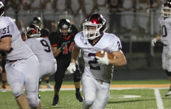 Mickey HInes runs the ball in Solon. Photo/Macy Griebel.