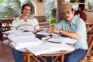 Pablo Escobar and his cousin, Gustavo, discussing business in "Narcos"