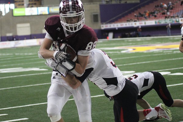 Connor Herrmann runs the ball at the state 2A finals. Herrmann caught 10 passes for 205 yards and scored four TDs.
