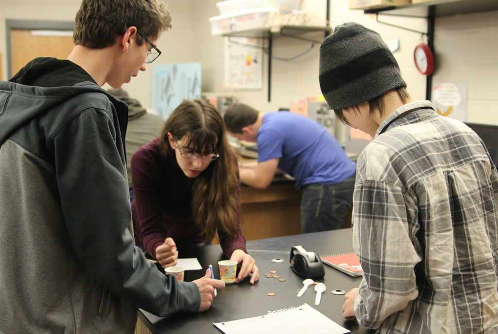 Students in Popular Science Chemistry with Mrs. Appley conduct an experiment. Photo by Grace McCollum.