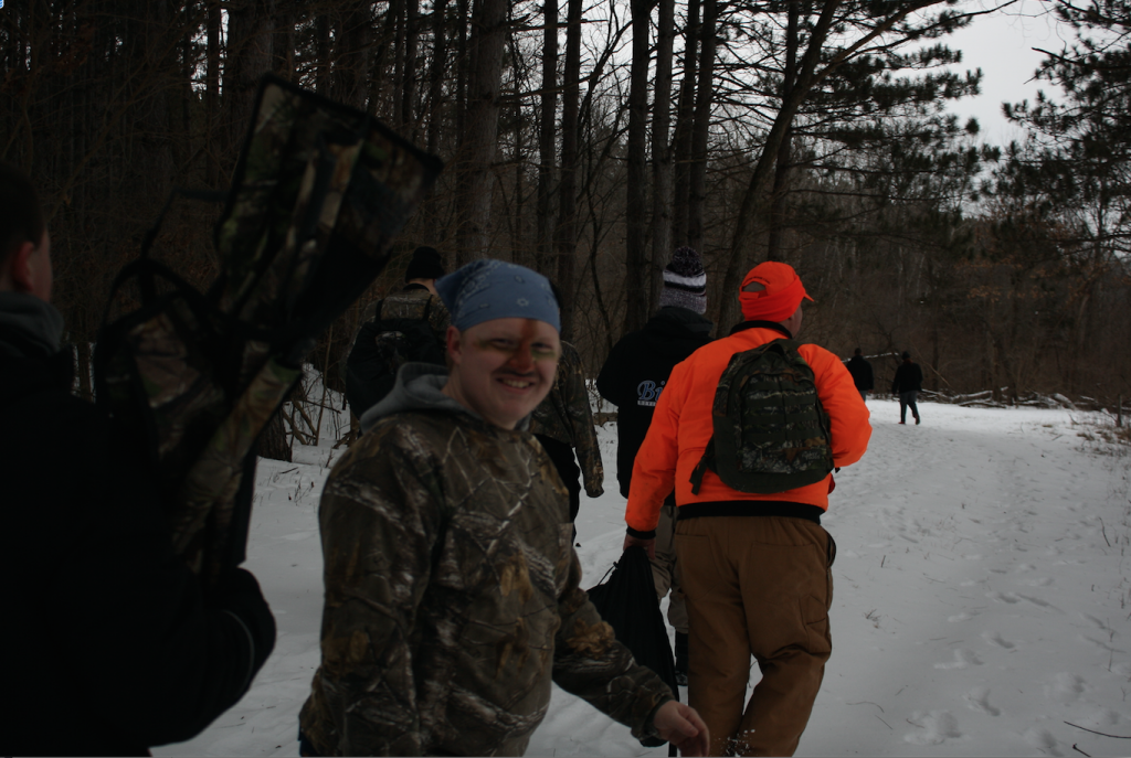 Senior Morgan Reilly shows off his camouflage on the Outdoor Pursuits class field trip to Matsell Bridge in Central City Jan. 6. Photo/Brian Harris.