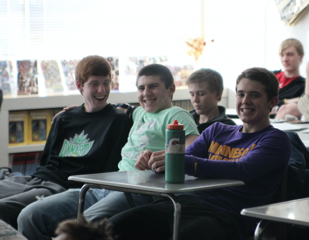 Sophomores Garrett Welch, Colden Clark, and Drew Adams are excited to learn about the Cold War through James Bond movies taught by Maggie Willems and Scott Weber. Photo/Macy Griebel.