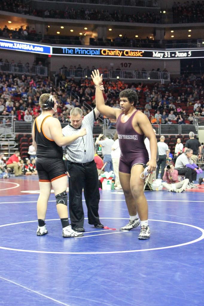 Junior Tristan Wirfs gets his hand raised after defeating Brody Tupy from Charles City.   Photo: Jessika Brokel 