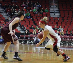Defending the basket, junior Hayley Corkin guards Elle Ruffridge of Pocahontas Area.
