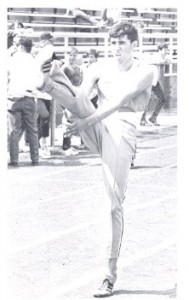 Dennis Roloff does leg exercises before the district meet his senior year in high school.