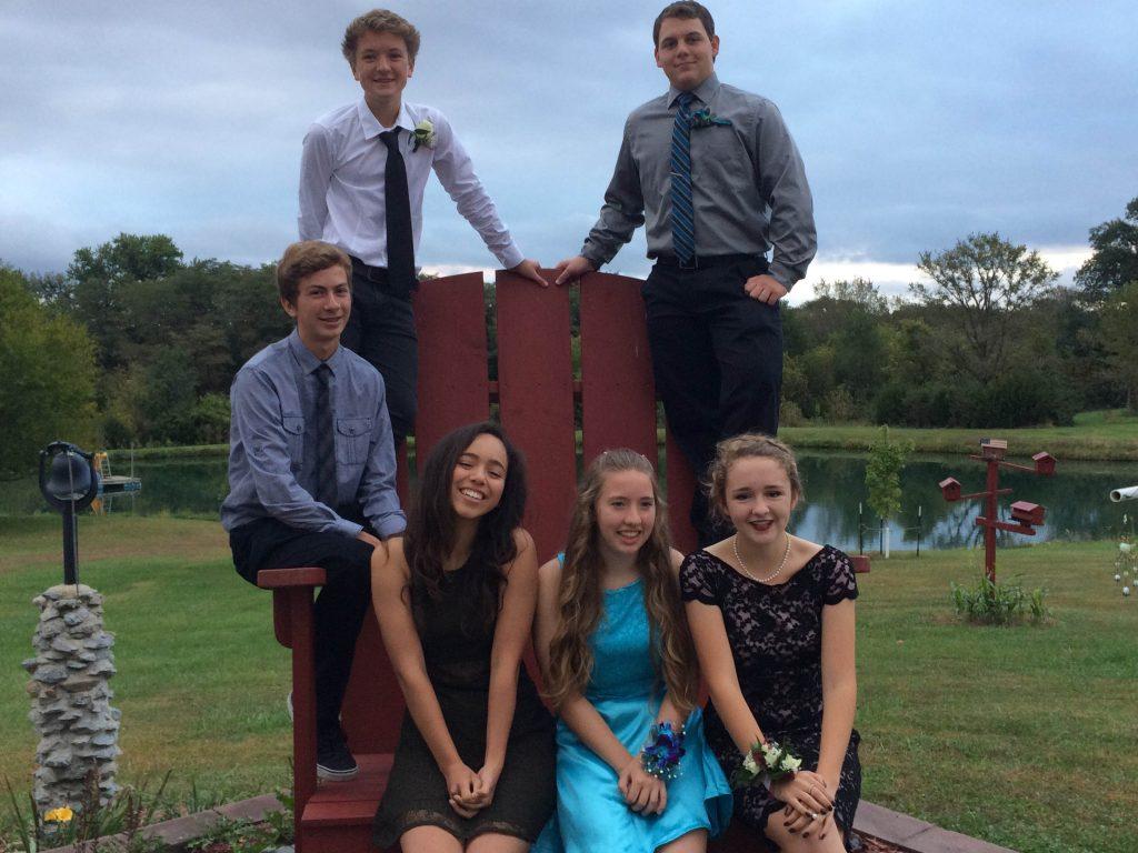 Fynn Utermark's group takes pictures before the homecoming dance. 