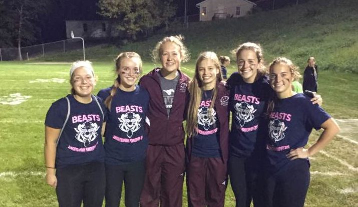 Kyli Orr, second from left, poses with some of her friends from Mount Vernon after winning the 2016 powderpuff game.