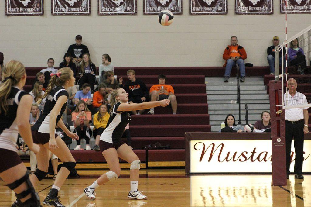 Wynne Vandersall bumps the ball at the first round of regionals Wednesday.  The Mustangs beat Solon in three sets. Photo by Emma Klinkhammer.