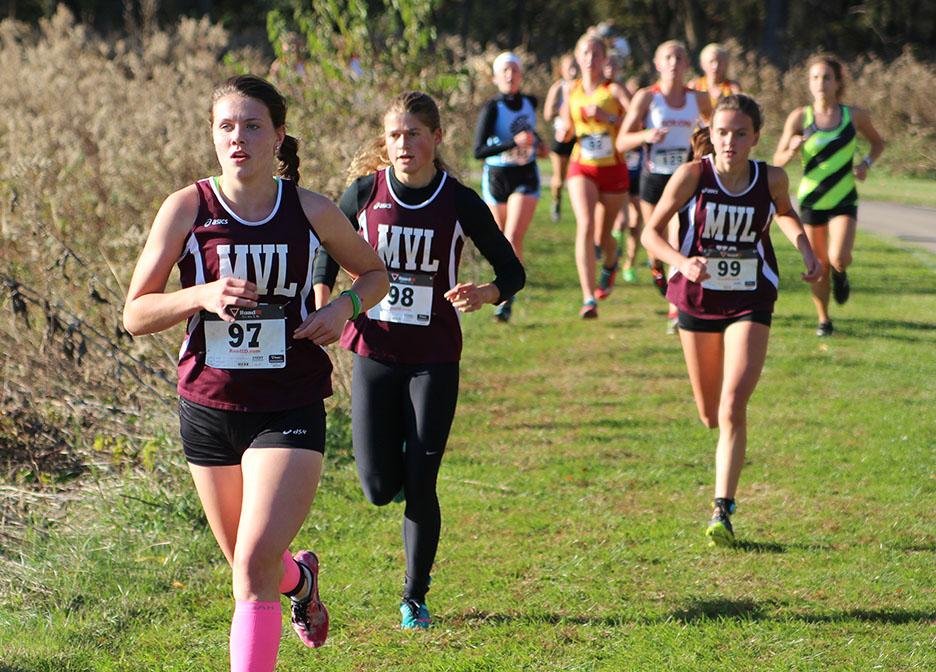 Hayley Corkin, Maggie Davis, and Aubrey Frey run at the state qualifying meet. Placing first for the Mustangs was Corkin in a time of 20:17. Corkin placed seventh overall. Photo by Ben McGuire.