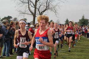 Thatcher Krob prepares to pass Gus Hayes of Decorah, with teammate Chase McLaughlin just behind. Krob finished first for Mount Vernon-Lisbon, with a time of 16:33, and was seventh overall. Photo by Ben McGuire.