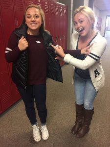 Seniors Nicole Binsfield and Hannah Moss pose with their "I voted" stickers. 