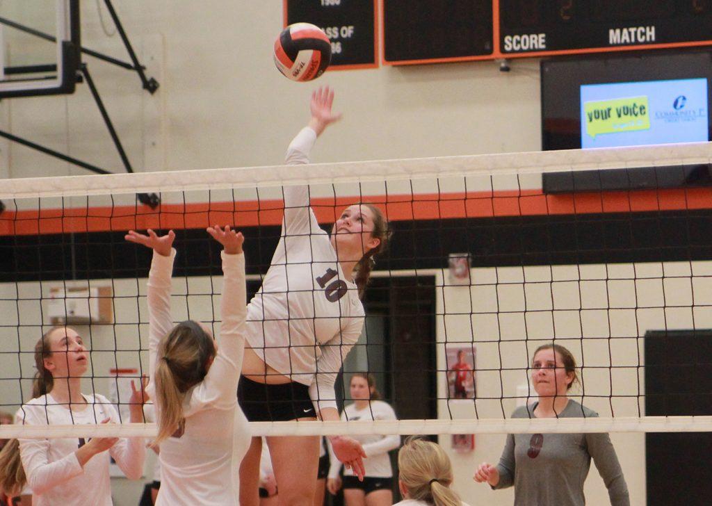 Katie Wycoff spikes the ball against Davis County on Monday. The Mustangs won in three sets.