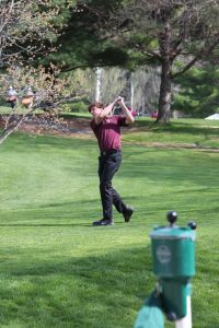 Drew Wolfe follows throu on his tee shot on the first hole at Kernoustie golf course. The Mustangs won the meet and Wolfe shot a 39. April 24. Photo by Paige Zaruba