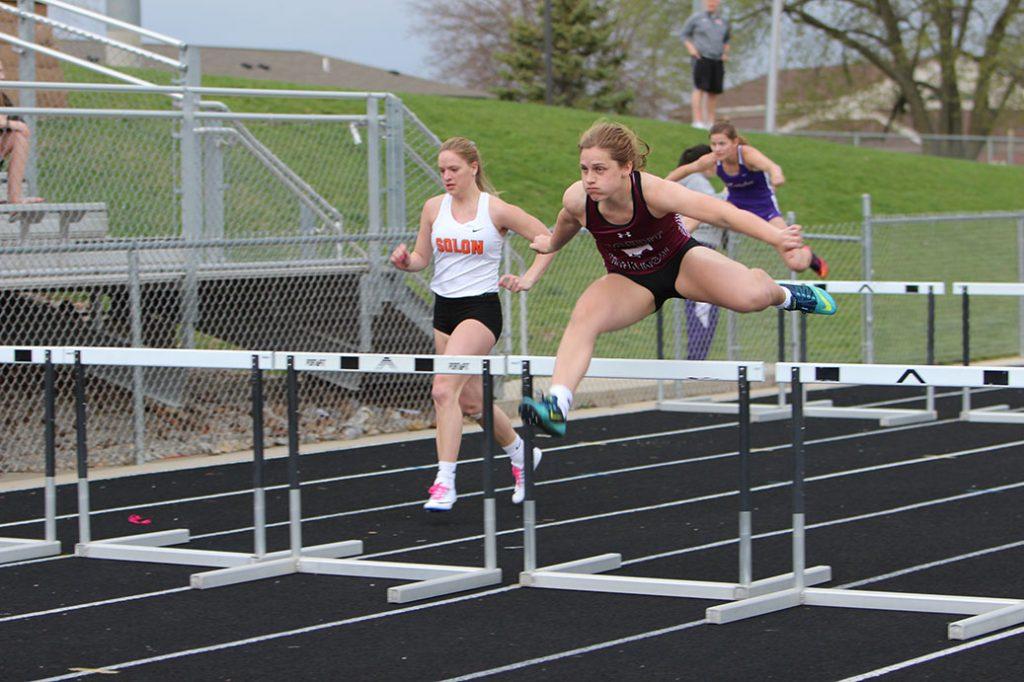Senior Libby Ryan hurdles during the Shuttle Hurdle race on April 18. The Shuttle Hurdle team got a new school record with a time of 1:05.99