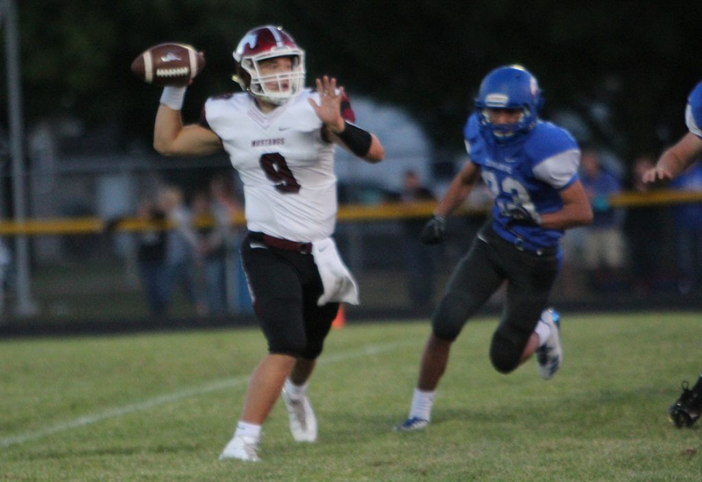Drew Adams throws a pass in Fridays 69-0 win against Camanche on Sept. 8. Photo by Emma Klinkhammer. 