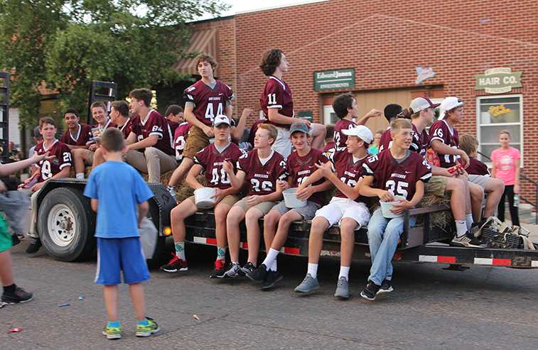 The JV football team rides in the homecoming parade Sept. 22. Photo by Lauren McCollum