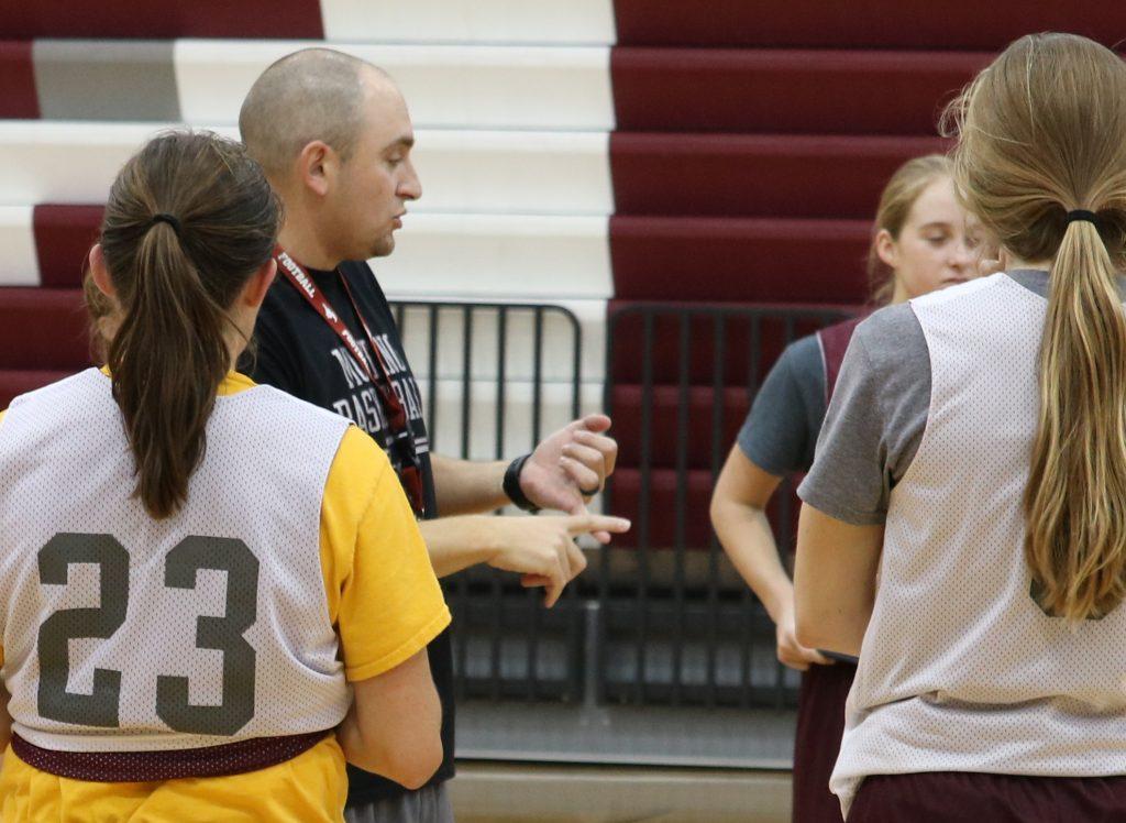 At the end of practice, Coach Matt Haddy talks with the girls. Photo by Paige Zaruba. 