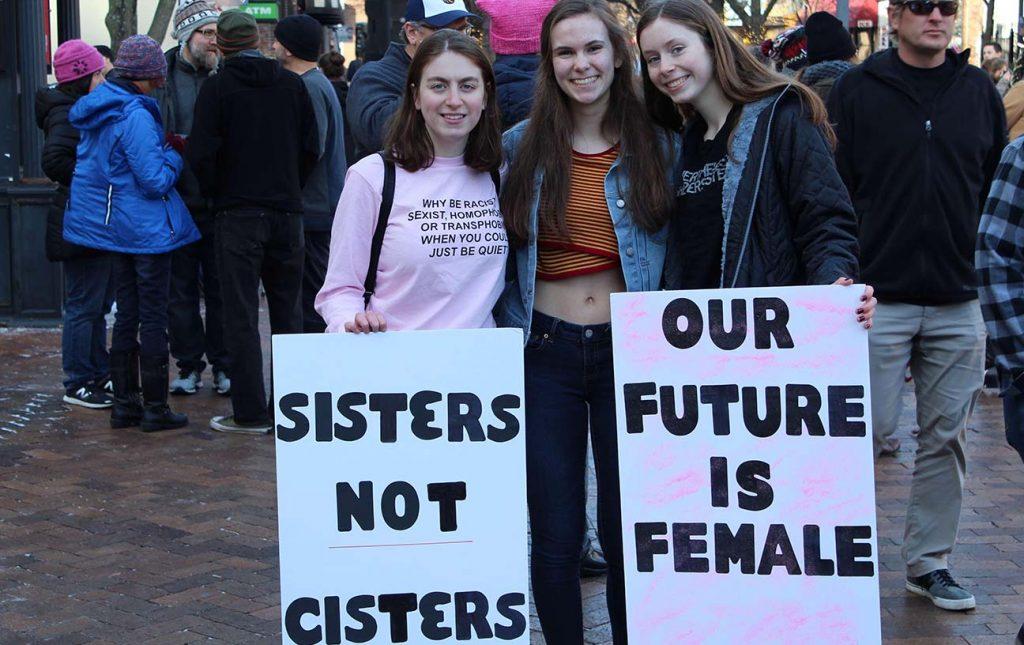 Sophomores Megan Zobac, Caroline Voss, and Annie Leopold pose for a photo during the womens march on Jan. 20, 2018.