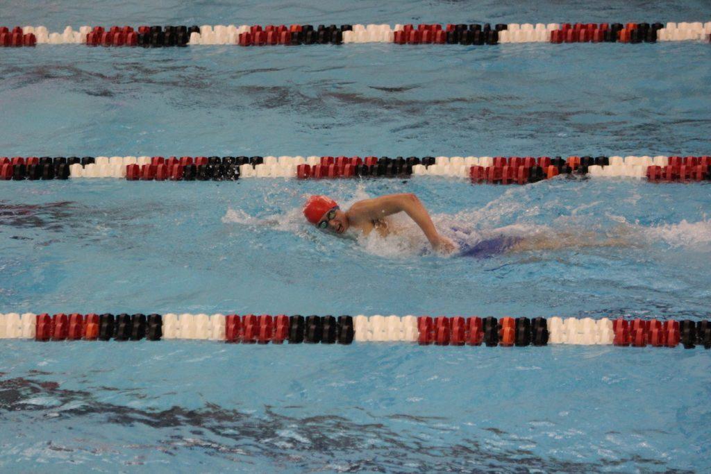 Zack Kolker swimming in the 500 free which he placed second in on Feb. 3 Photo by Ben McGuire