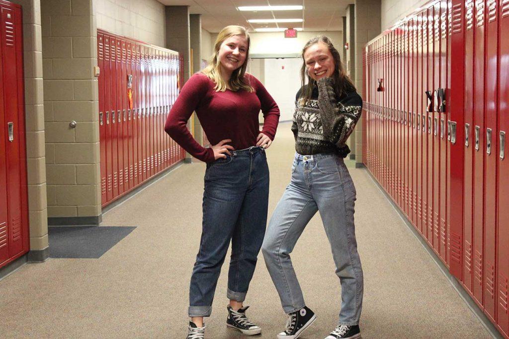 Juniors Grace Krapfl and Quinnie Rodman pose to show off their mom jeans on Feb. 22.